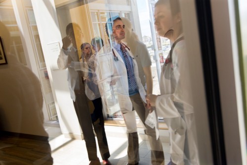 medical school students through a window