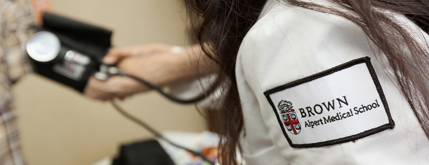 medical student taking blood pressure